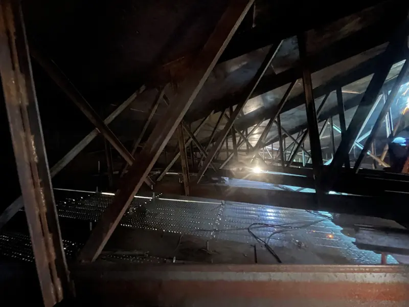 Before: rusted trusses