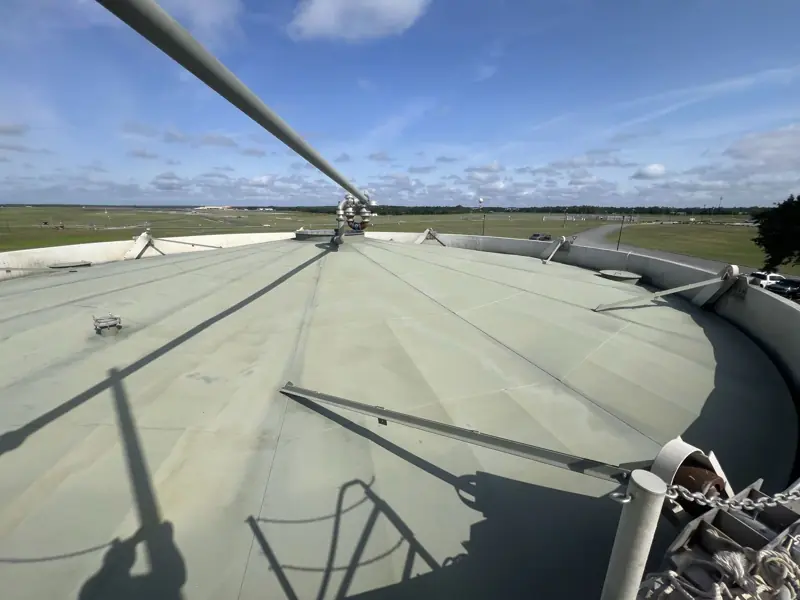 Recoated tank roof