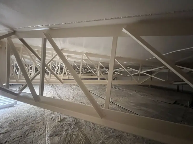 Coated trusses inside the tank